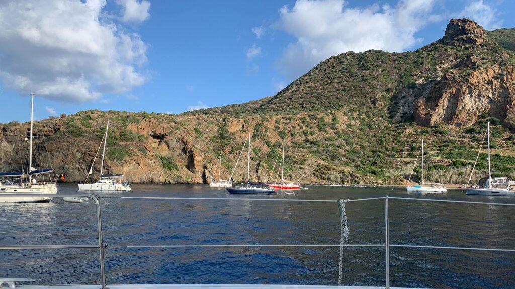 Catamaran MySailCruise anchored in Panarea's crystal-clear bay, Aeolian Islands.
