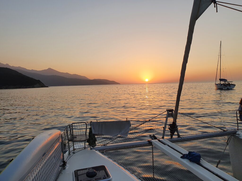 Sunset at Capraia Isle seen from Catamaran