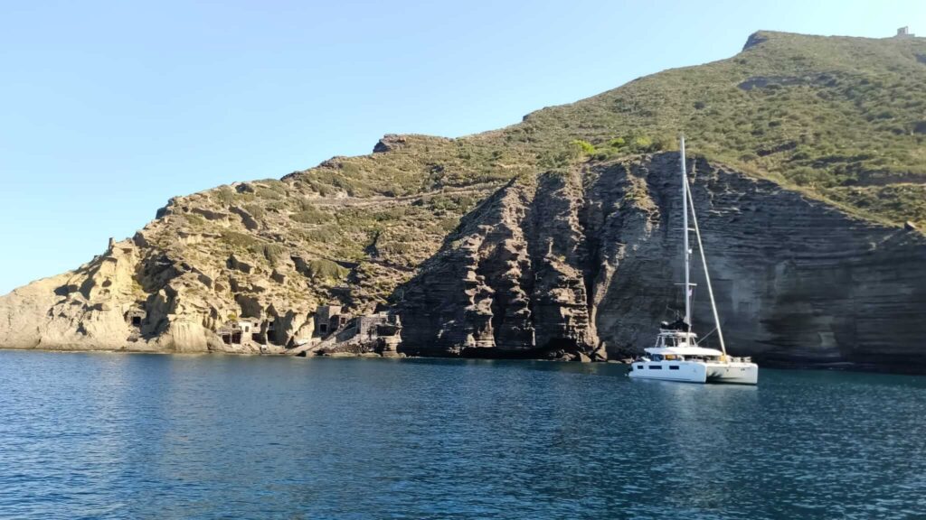 Mysailcruise catamaran touring Filicudi island, Aeolian Islands.