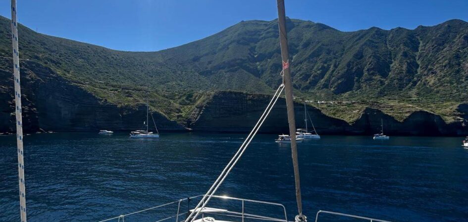 MySailCruise catamaran sailing in the crystal-clear waters of Salina, Aeolian Islands.
