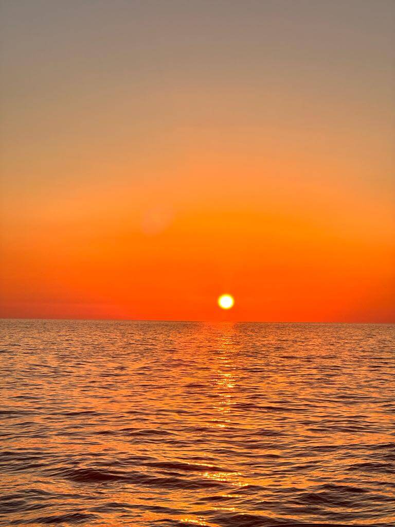 Breathtaking sunset over the sea, viewed from Filicudi island, Aeolian Islands.