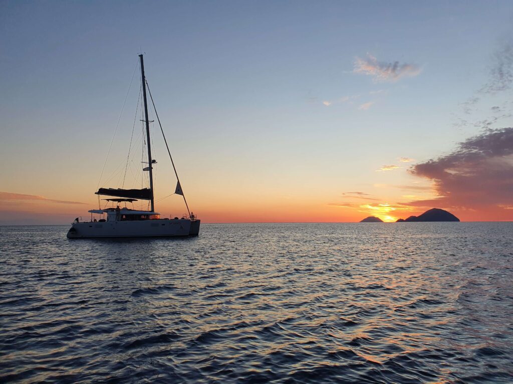Sunset behind Filicudi and Alicudi islands. Aeolian Islands sailing with MySailCruise.