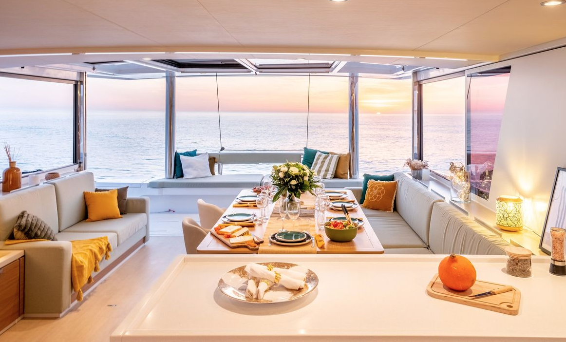 BALI catamaran living and dining area with sea view – MySailCruise
