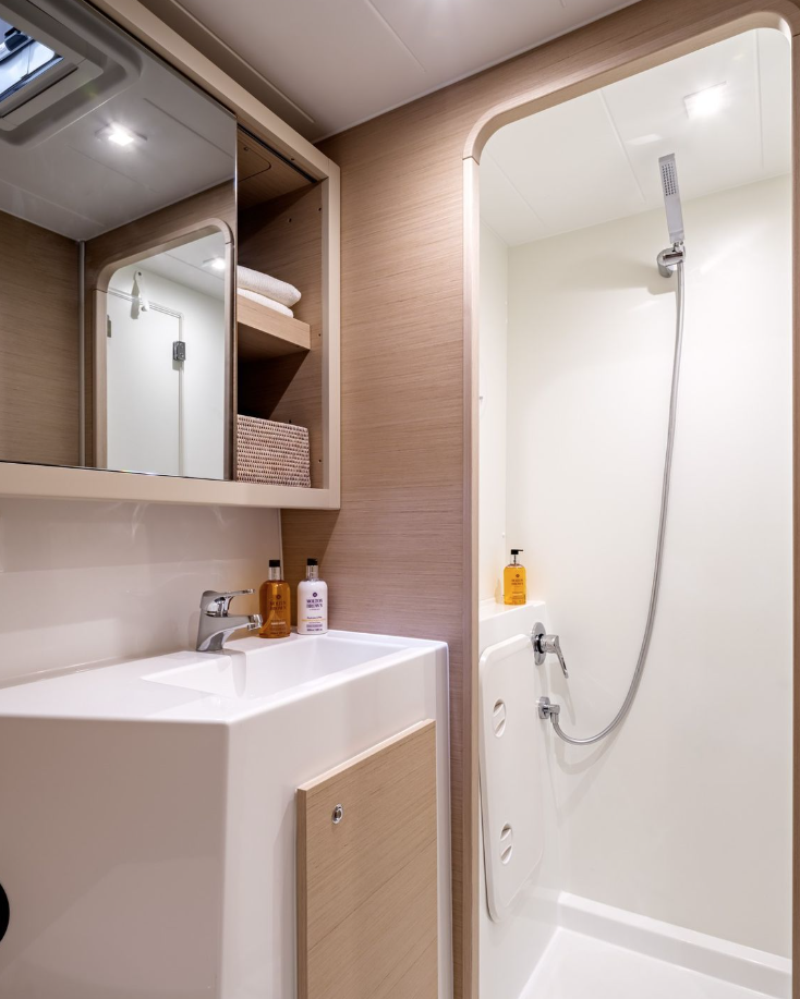 Modern private bathroom with shower aboard a luxury catamaran – MySailCruise